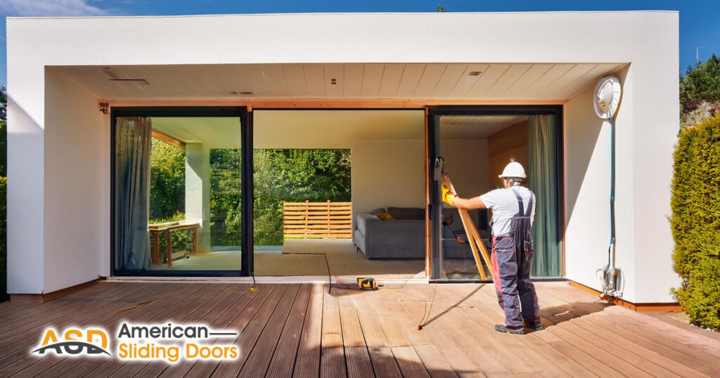 technician working installing sliding doors beautiful home